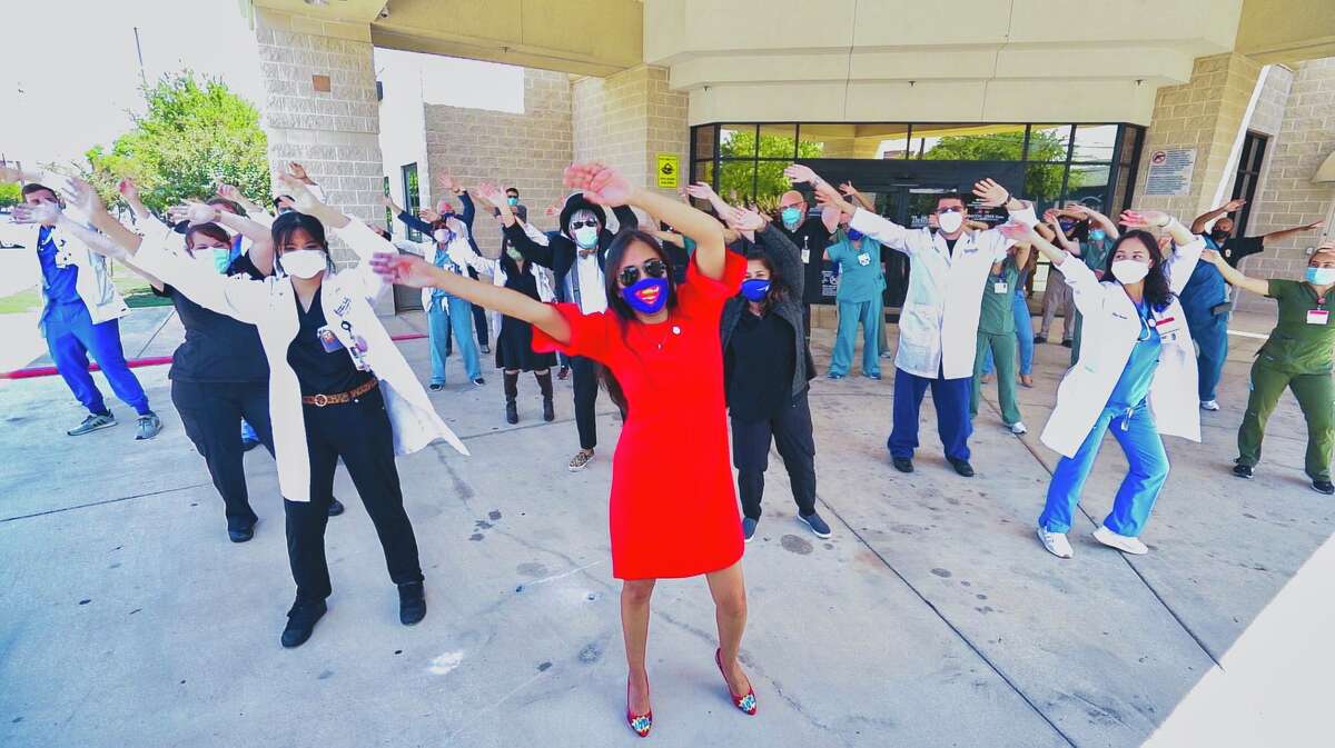 District 4 Councilwoman Adriana Adriana Rocha Garcia leads 67 frontliners and essential working health workers at Southwest General Hospital as she also dances with Michael Quintanilla in his 2020 dance video.