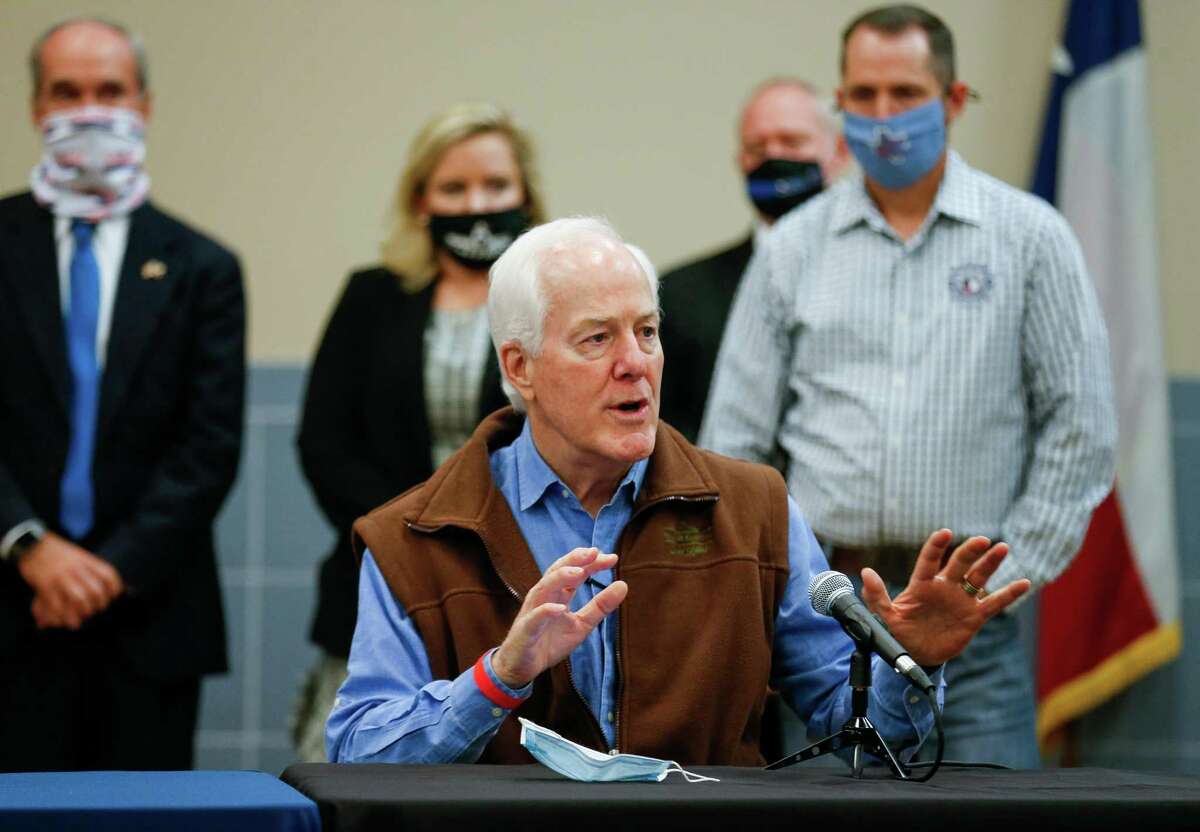 Sen. John Cornyn talks to reporters during a press conference inside the Houston Police Officer's Union Headquarters, where he signed a "back the blue" pledge Wednesday, Oct. 28, 2020, in Houston.