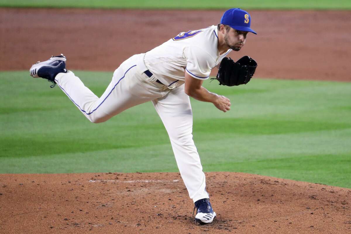 SEATTLE, WASHINGTON - AUGUST 02: Kendall Graveman #49 of the Seattle Mariners pitches in the second inning against the Oakland Athletics during their game at T-Mobile Park on August 02, 2020 in Seattle, Washington. (Photo by Abbie Parr/Getty Images)
