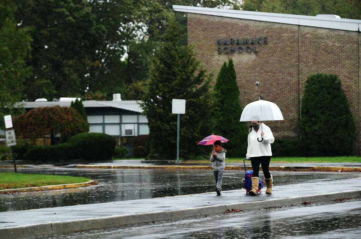 Naramake Elementary School Thursday, October 29, 2020, in Norwalk, Conn. A teacher at Naramake who has a preexisting medical condition says the school district is making her choose between her health and her livelihood after they denied her a remote teaching assignment, according to a lawsuit filed in federal court.