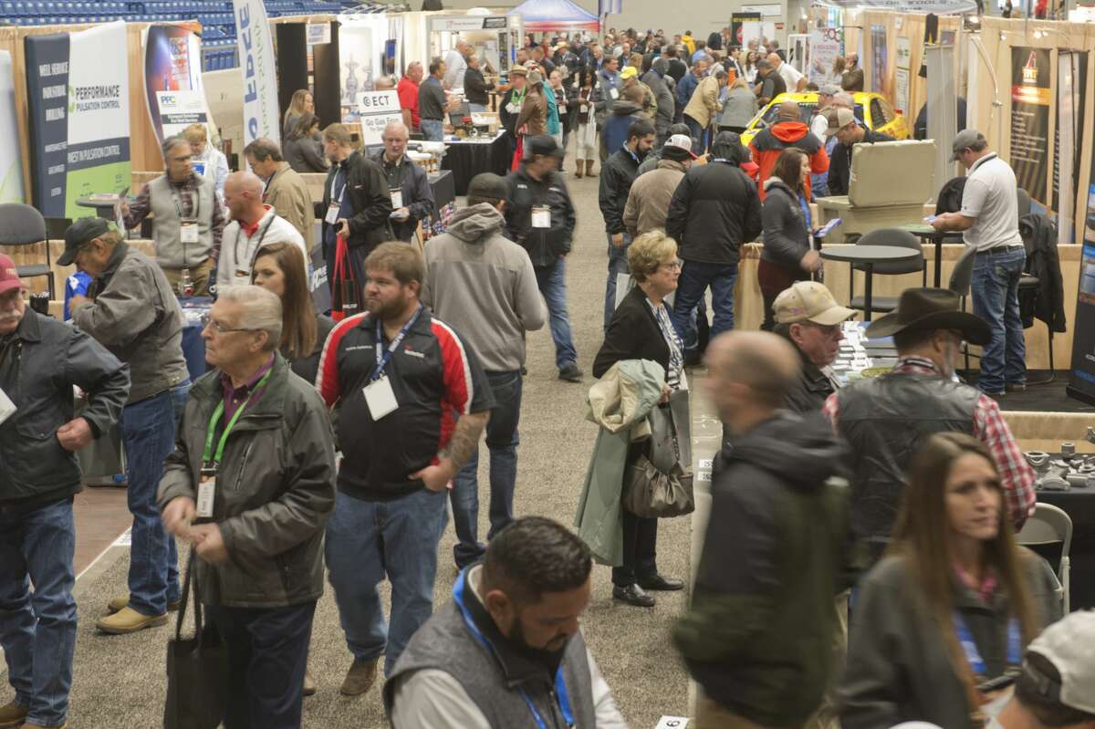 A crowd wanders through the indoor booths set up inside Ector County Coliseum Oct. 16, 2018, for the Permian Basin International Oil Show.