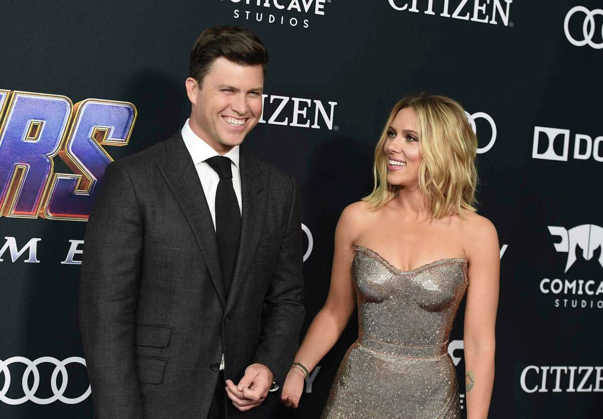 FILE - In this April 22, 2019 file photo, Colin Jost, left, and Scarlett Johansson arrive at the premiere of "Avengers: Endgame" in Los Angeles. Meals on Wheels America announced Thursday on Instagram that Johansson and Jost married over the weekend in an intimate ceremony. (Photo by Jordan Strauss/Invision/AP, File)