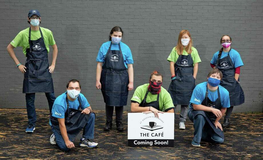 Seven of the nine employees who will work at the new Cafe at Greenwich Library are pictured. The new competitive employment opportunity will offer people with disabilities meaningful employment, nonprofit leaders at Greenwich-based Abilis said. Photo: Contributed / Contributed Photo / Greenwich Time