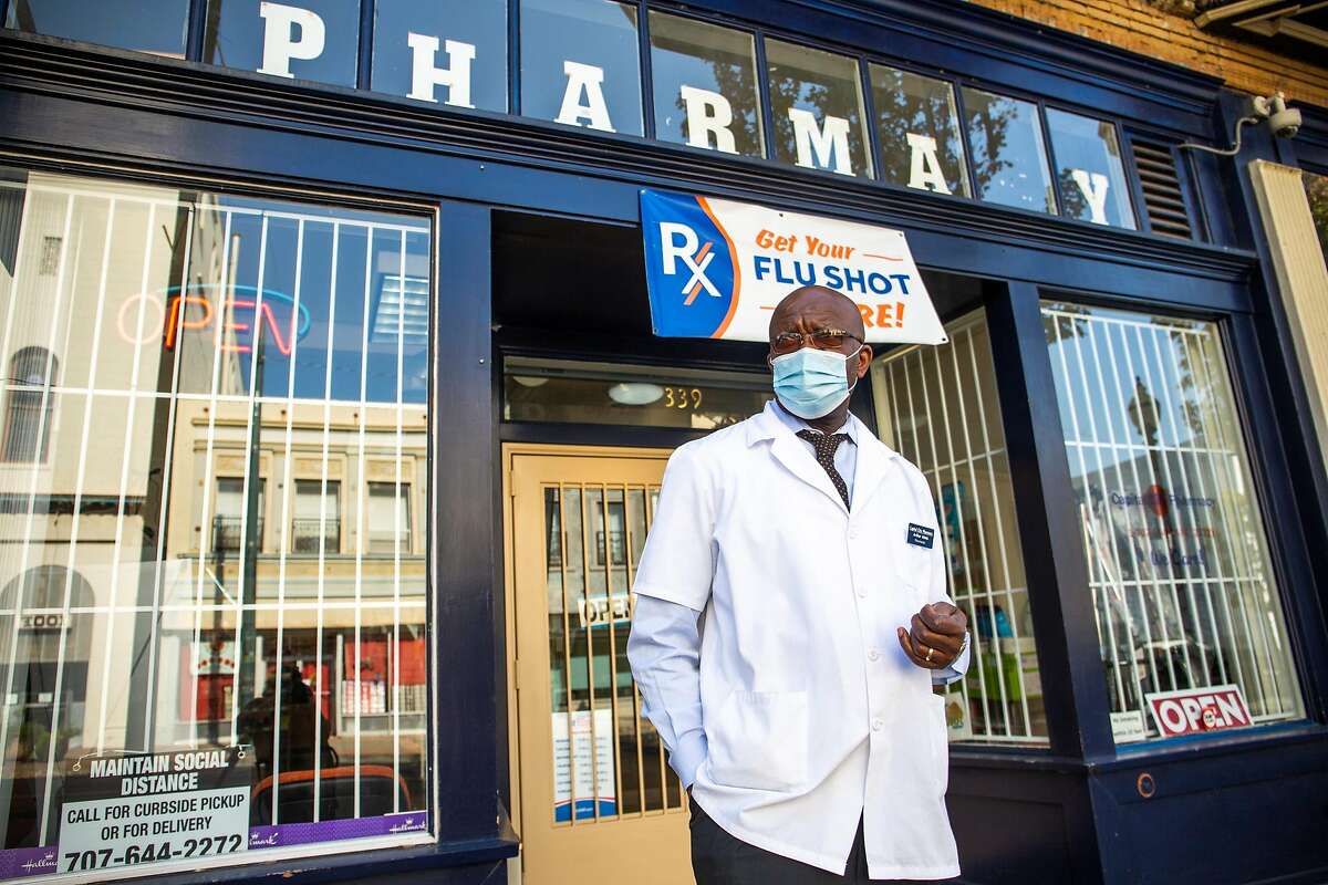 Arthur Metu, owner of Capital City Pharmacy for the last four years, stands outside his pharmacy in downtown Vallejo.