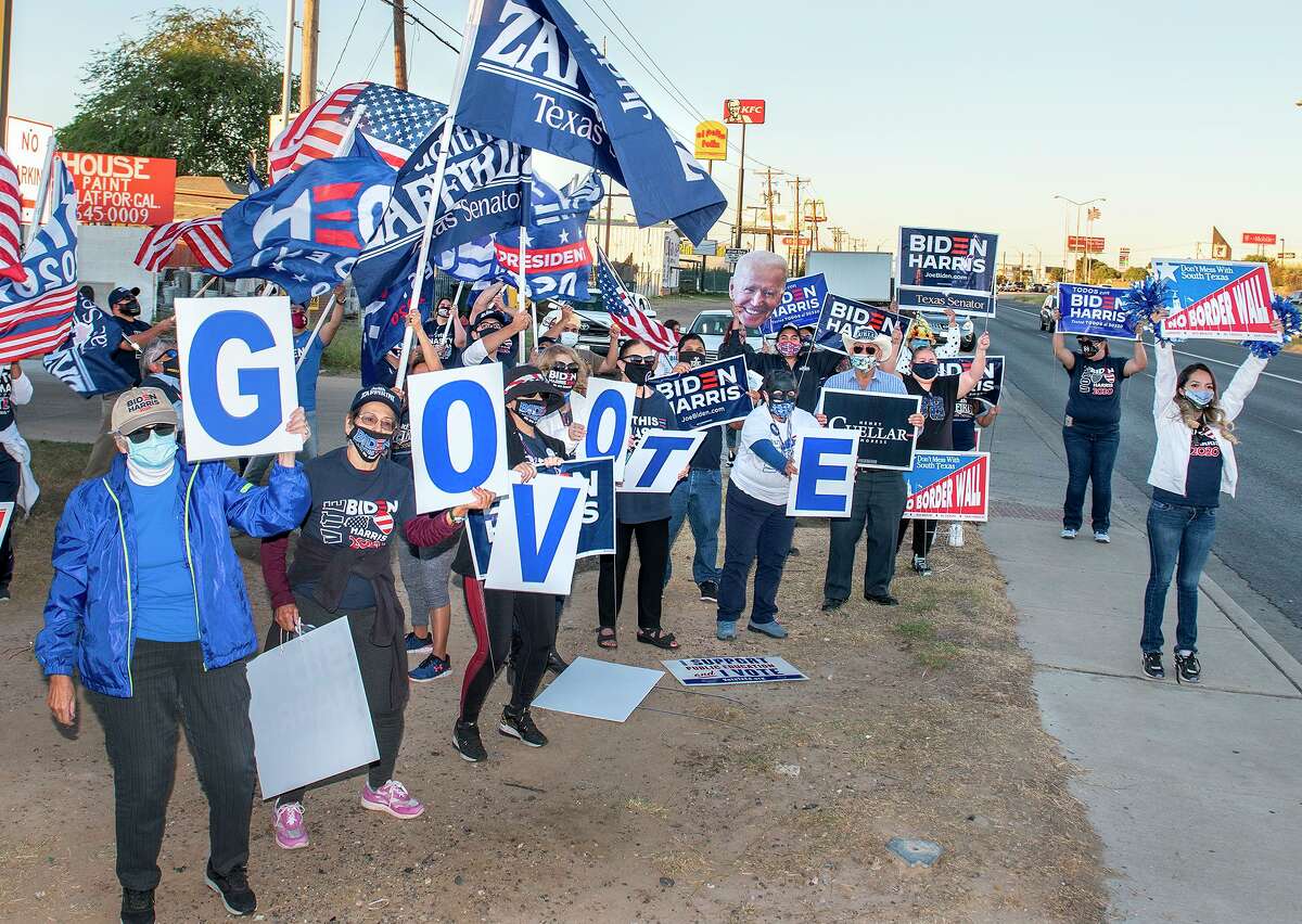 Supporters of presidential candidate Joe Biden gather at the intersection of Palo Blanco St. and Zapata Highway, Thursday, Oct. 29, 2020, during the “Everybody Vote Now!” Get Out the Vote Dance Challenge.