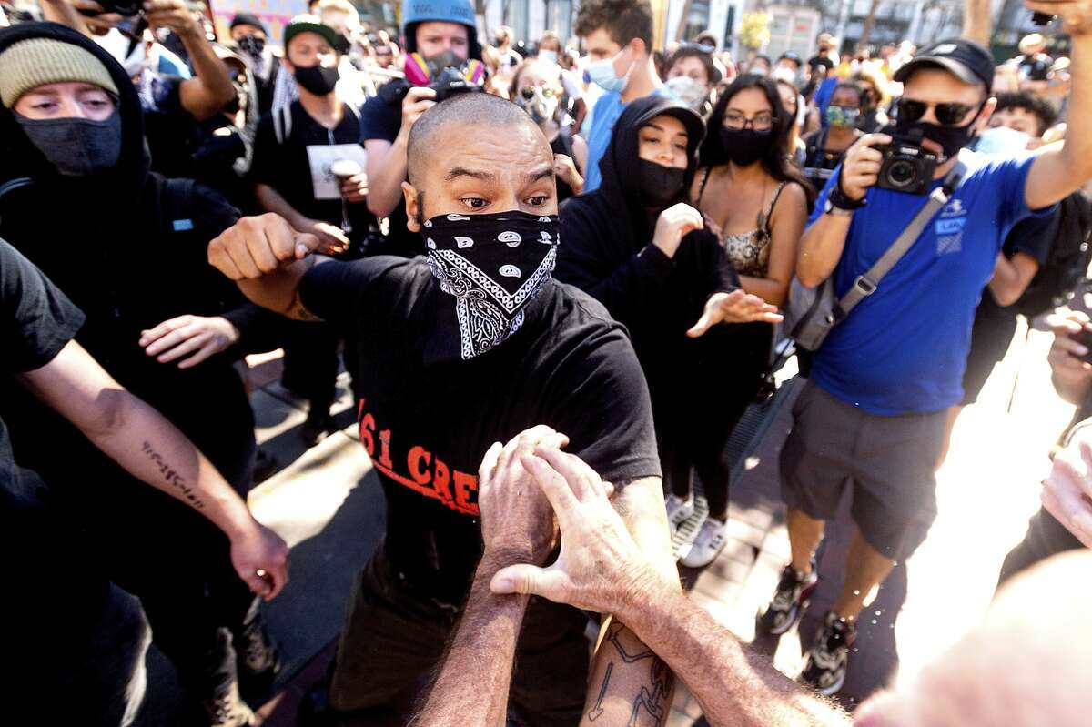A counterprotester prepares to punch a supporter of President Trump at a San Francisco rally in October.