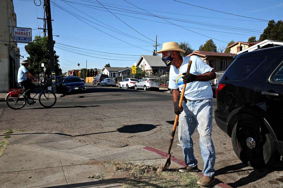 Richard Breaux participates in a neighborhood cleanup at 62nd Avenue and Hayes Street last month. Breaux and his wife, Zenobia, are also members of the Reimagining Public Safety Task Force. Photo: Photos By Yalonda M. James / The Chronicle