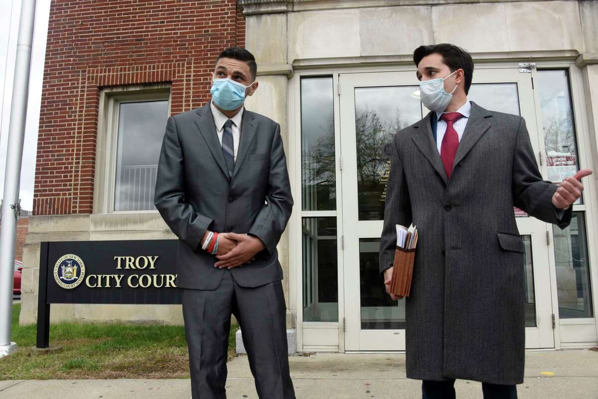 Barker Park Coalition activist Kenneth Zeoli, left, is seen outside of Troy City Court with his attorney Matthew Toporowski, right, after a hearing on Friday, Oct. 30, 2020 in Troy, N.Y. Zeoli alleges that he was pushed down stairs in the Troy police station, injuring his shoulder after attempting to file a report. (Lori Van Buren/Times Union)