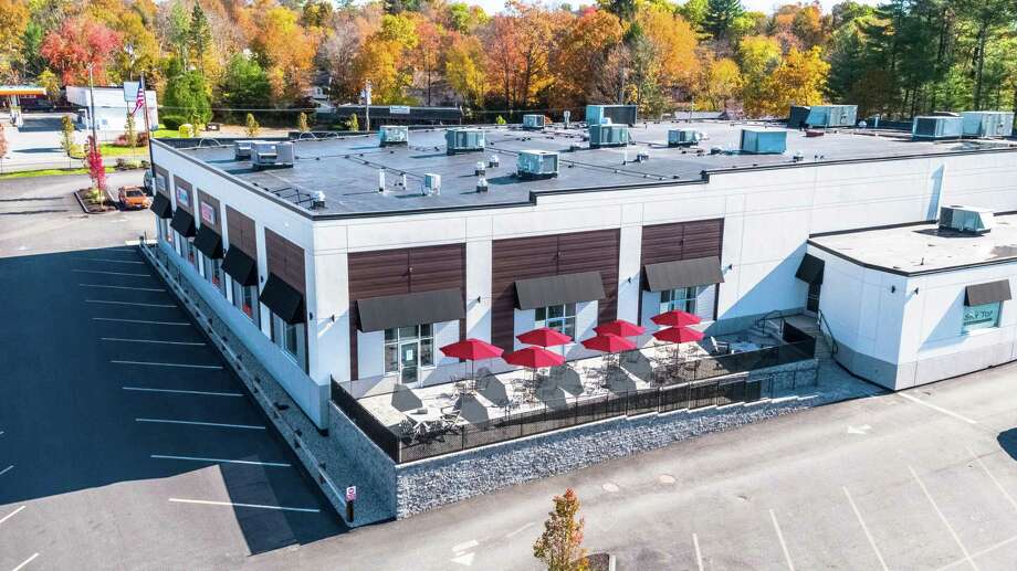 The Shops at Skytop include a patio that serves visitors to Hartford HealthCare’s walk-in health clinic, a gym and a day spa. Photo: PAC / Contributed Photo /