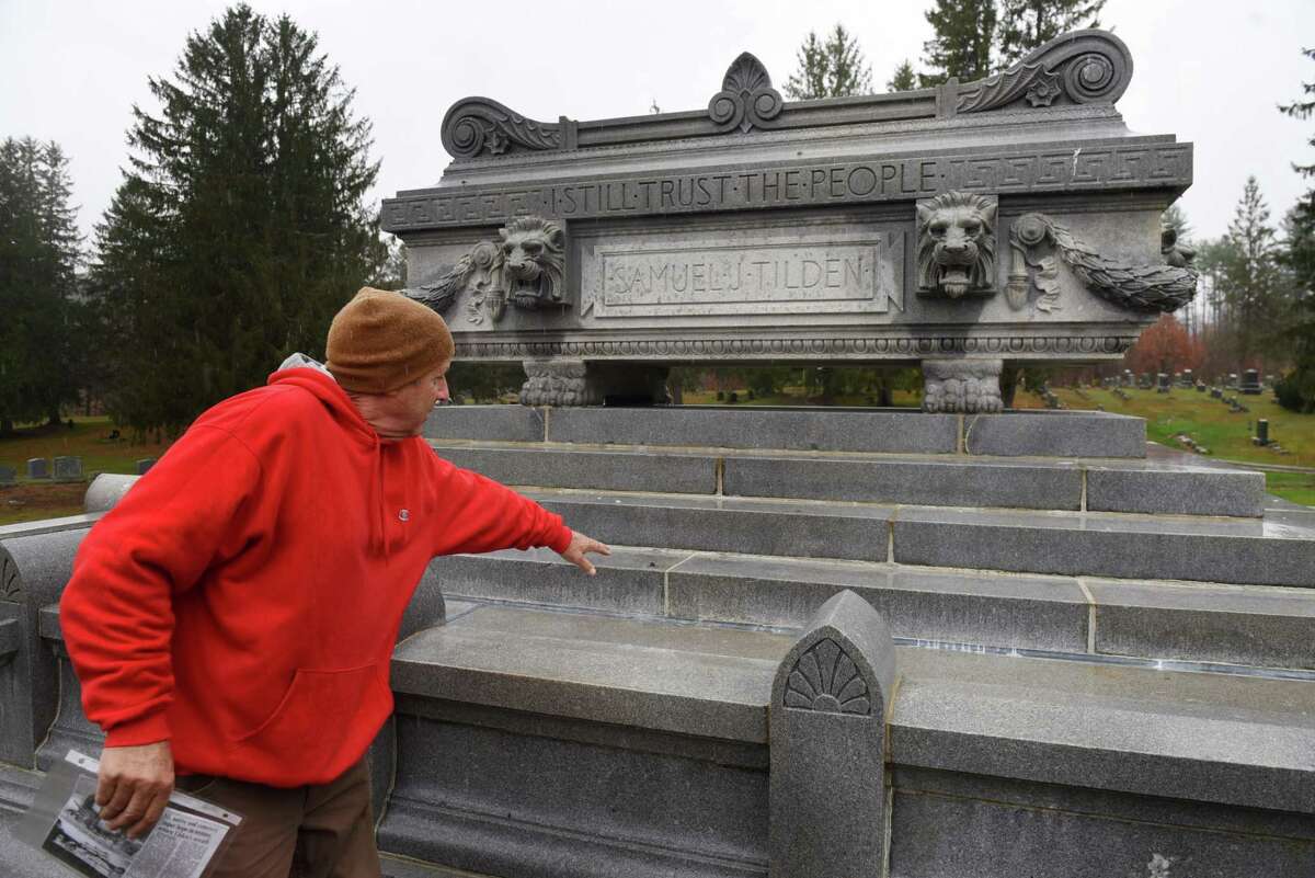 Ed Godfroy, cemetery superintendent at Cemetery of the Evergreens, points to where a bronze wreath was taken from the grave of former New York governor Samuel J. Tilden on Thursday, Oct. 29, 2020, at Cemetery of the Evergreens in New Lebanon, N.Y. Tilden was the Democratic candidate for president in 1876. He lost to Rutherford B. Hayes in a contested election. (Will Waldron/Times Union)