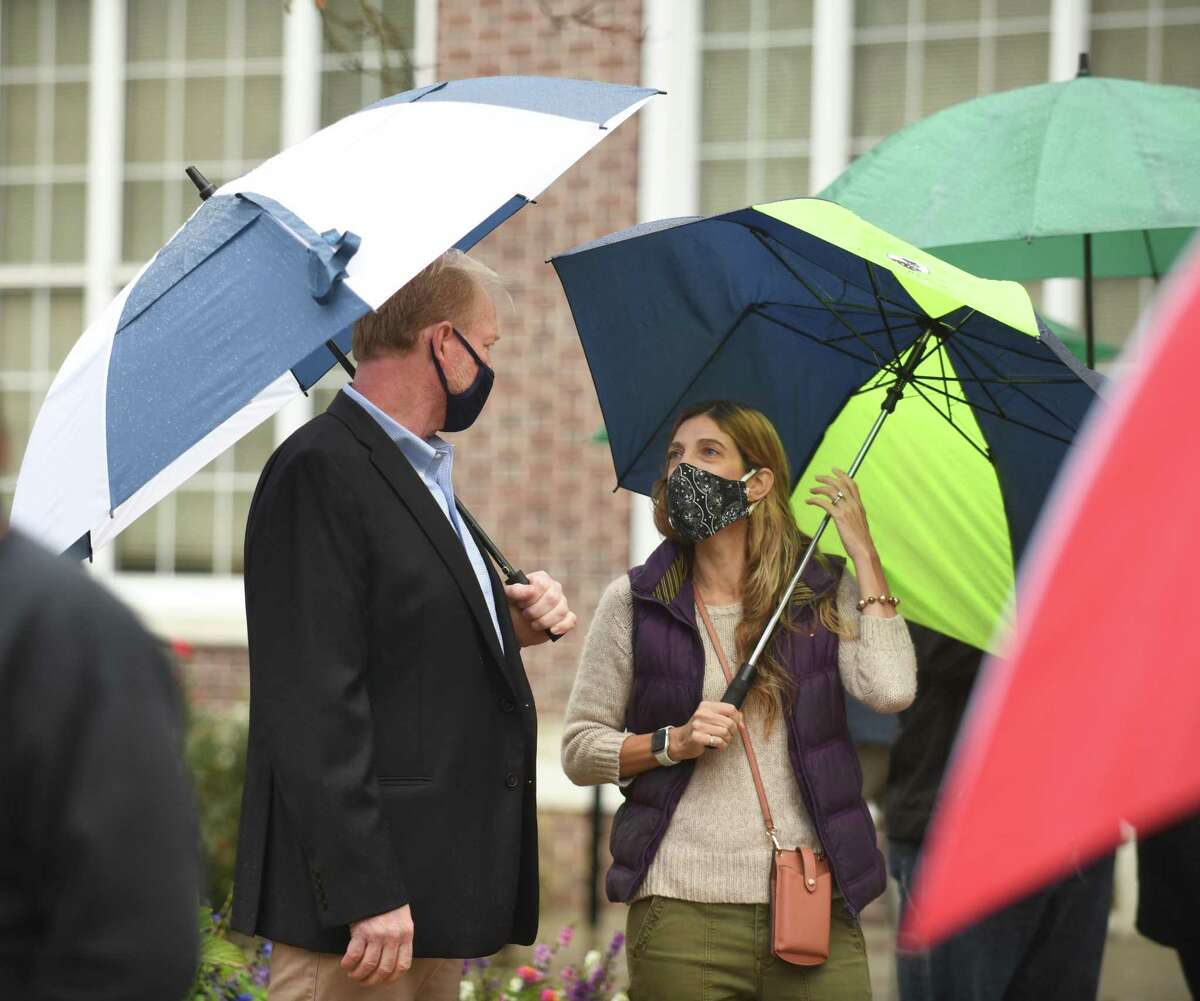 Republican candidate for state representative of District 150, Joe Kelly, and Democratic candidate for District 149 Kathleen Stowe chat during the Columbus Day flag Italian raising outside Town Hall in Greenwich on Oct. 12.