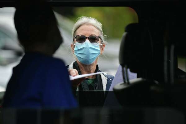 Laura Wood was one of the nurses taking part in a drive-thru flu shot clinic at the offices of Visiting Nurse &amp; Hospice of Fairfield County Oct. 28 in Wilton.