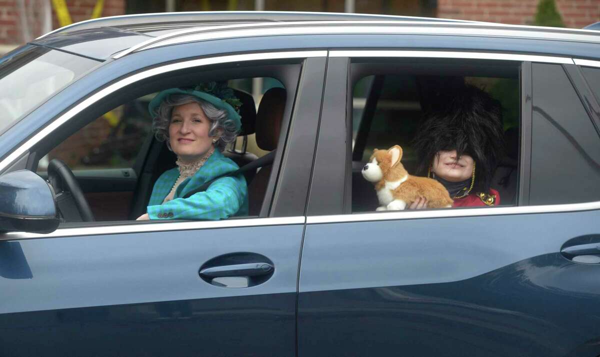 The queen and her royal guard, Natalie and Chase Levitt, attended the drive-thru Halloween event held at the Comstock Community Center by the Parks & Recreation Department. Friday, Oct 30 in Wilton, Conn.