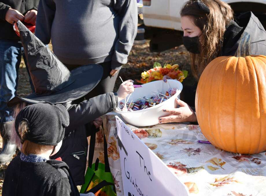 Ashley Gutowski, of the Brethren Boosters, offers some candy to a young witch on Saturday. Photo: Arielle Breen/News Advocate