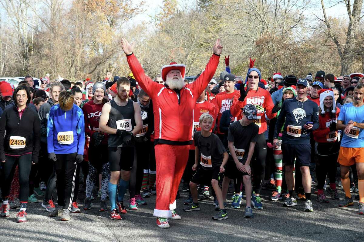 Bill Buckbee, aka Santa, gets the field ready for the start of the Run Santa Run 5k Run, Walk and Kids Fun Run at Harrybrooke Park in New Milford in 2017. This year’s event will be held at the park and virtually Nov. 28.