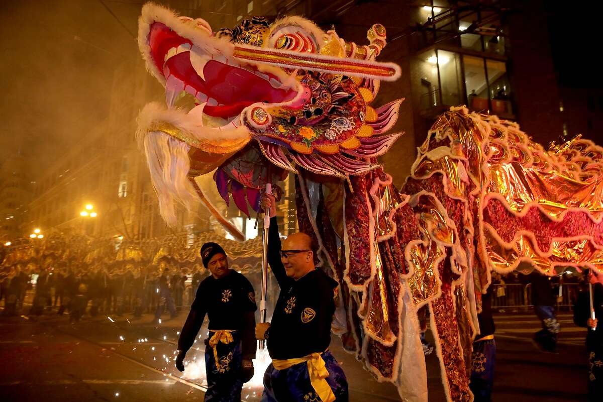 Members of the San Francisco Police Department Lion Dance Team carry a dragon during the Chinese New Year Parade in San Francisco in February. Next year’s parade has been canceled because of the coronavirus pandemic.