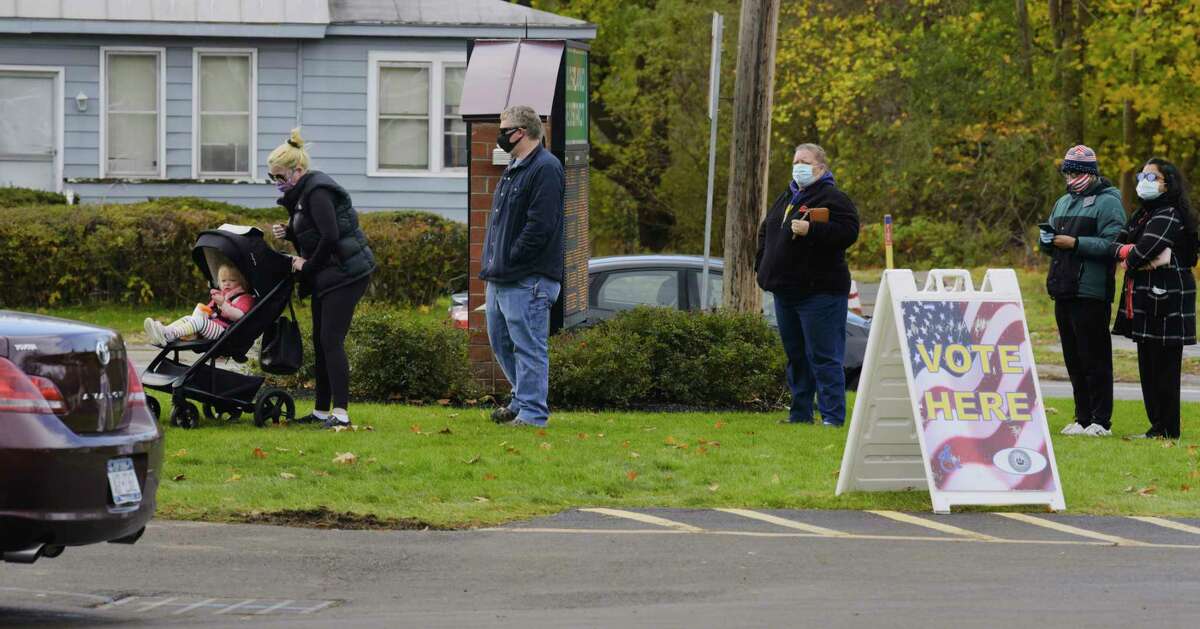 Voters wait in line outside the Guilderland Fire Department to cast their ballots in the final day of early voting on Sunday, Nov. 1, 2020, in Guilderland, N.Y. (Paul Buckowski/Times Union)
