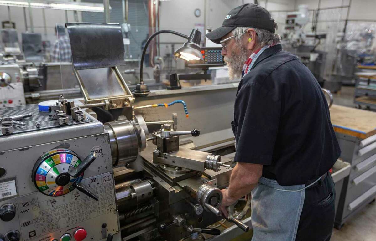 A machinist works with a lathe in Klaus Weiswurm' Innovation Technology Machinery building in Schertz Thursday, Oct. 29, 2020. In 2021, Weiswurm thinks factory automation will accelerate even faster than in recent years.
