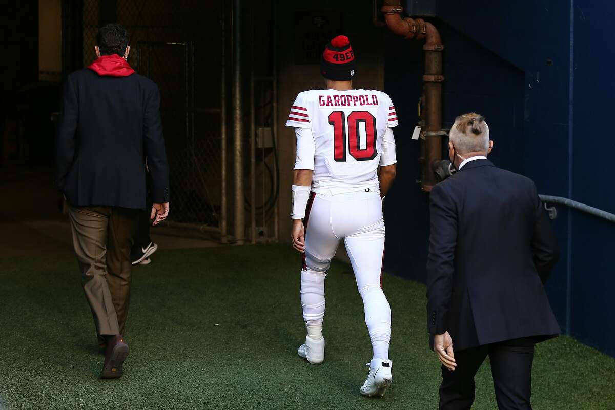 Quarterback Jimmy Garoppolo of the San Francisco 49ers exits the field as they play the at the start of the fourth quarter of the game at CenturyLink Field on Nov. 1, 2020, in Seattle.