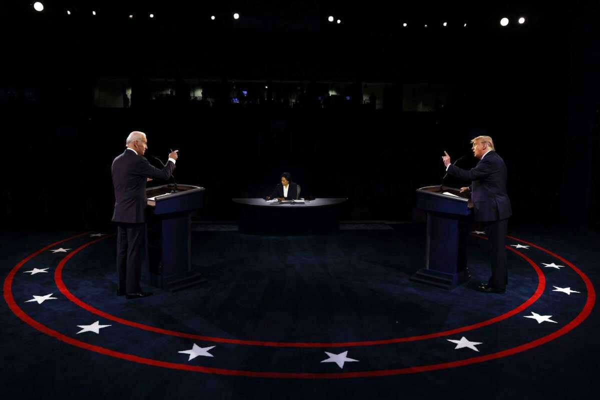 President Donald Trump and Democratic presidential candidate former Vice President Joe Biden participate in the final presidential debate at Belmont University, Thursday, Oct. 22, 2020, in Nashville, Tenn., as moderator Kristen Welker of NBC News listens.