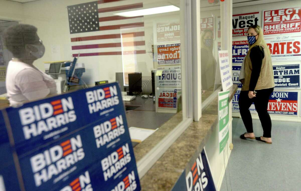 Mary Bond talks with Nancy Malbrough as she rounds the cornner to continue work as party workers and volunteers get ready for tomorrow's election and make final bids to voters at the Jefferson County Democratic Headquarters Monday. Photo taken Monday, November 2, 2020 Kim Brent/The Enterprise