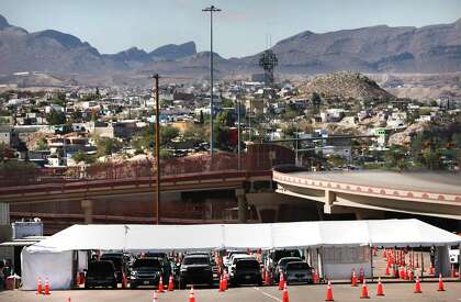 Vehicles line up in a parking lot in El Paso near the University of Texas for coronavirus testing offered by the state on Thursday, Oct. 29, 2020.