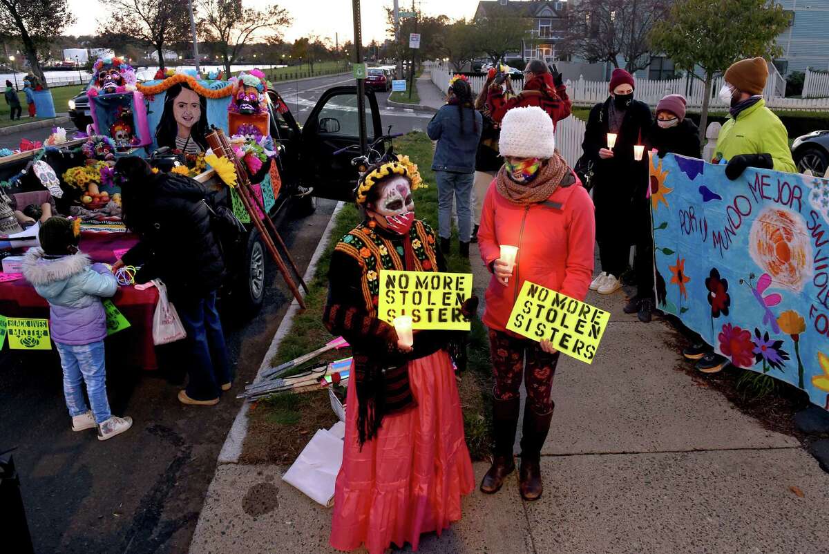 Members of the Justice for Lizzbeth Aleman-Popoca gather on Front Street in New Haven on November 2, 2020 for a Day of the Dead march in memory of Aleman-Popoca, who was killed in July and found in a shallow grave behind LoMonaco's Ristorante in Branford.