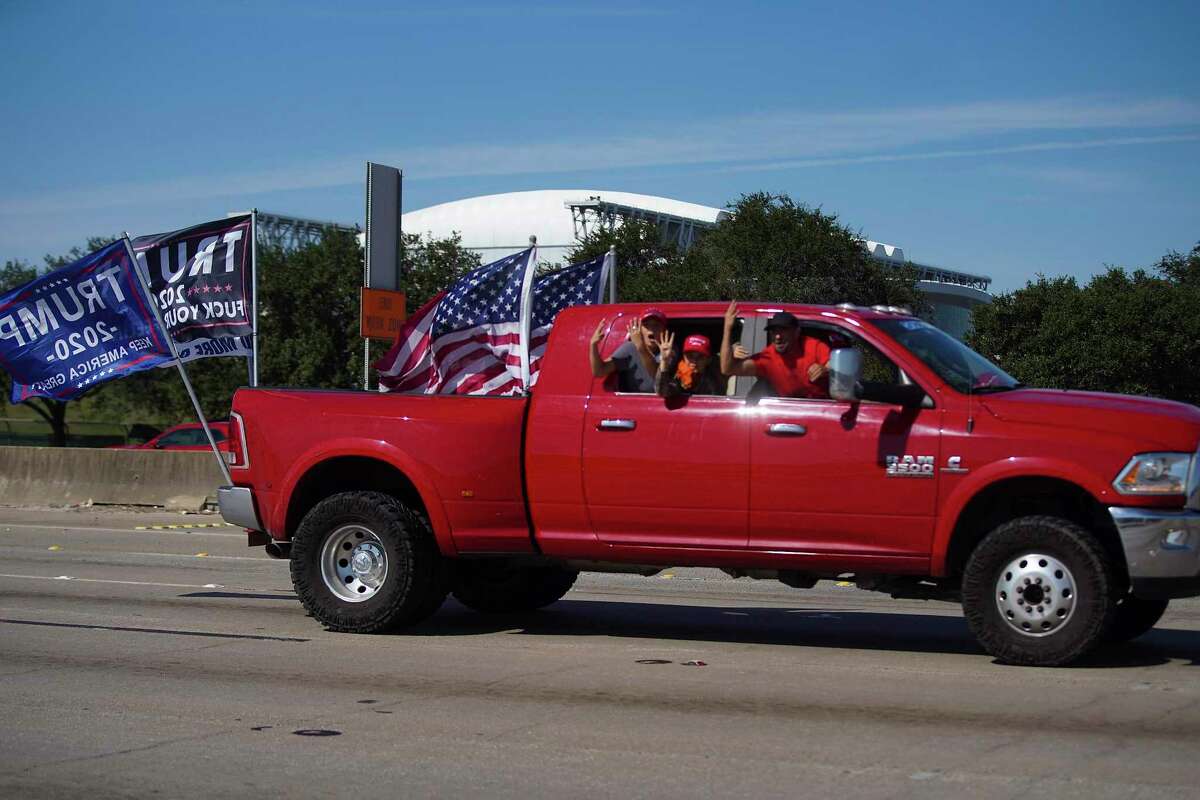 Trump supporters make their way on 610 in Houston on Sunday, Nov. 1, 2020.