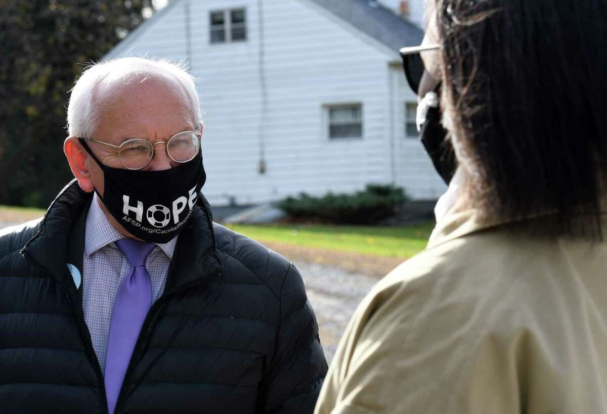 U.S. Rep. Paul Tonko, left, speaks to 49th State Senate district Democratic candidate Thearse McCalmon, right, after picking up lunch from the Malta Ridge United Methodist Church on Tuesday, Nov. 3, 2020, in Ballston Spa, N.Y. Tonko is challenge for the 20th Congressional District seat by Republican candidate Elizabeth Joy. McCalmon is running against Sen. James Tedisco. (Will Waldron/Times Union)