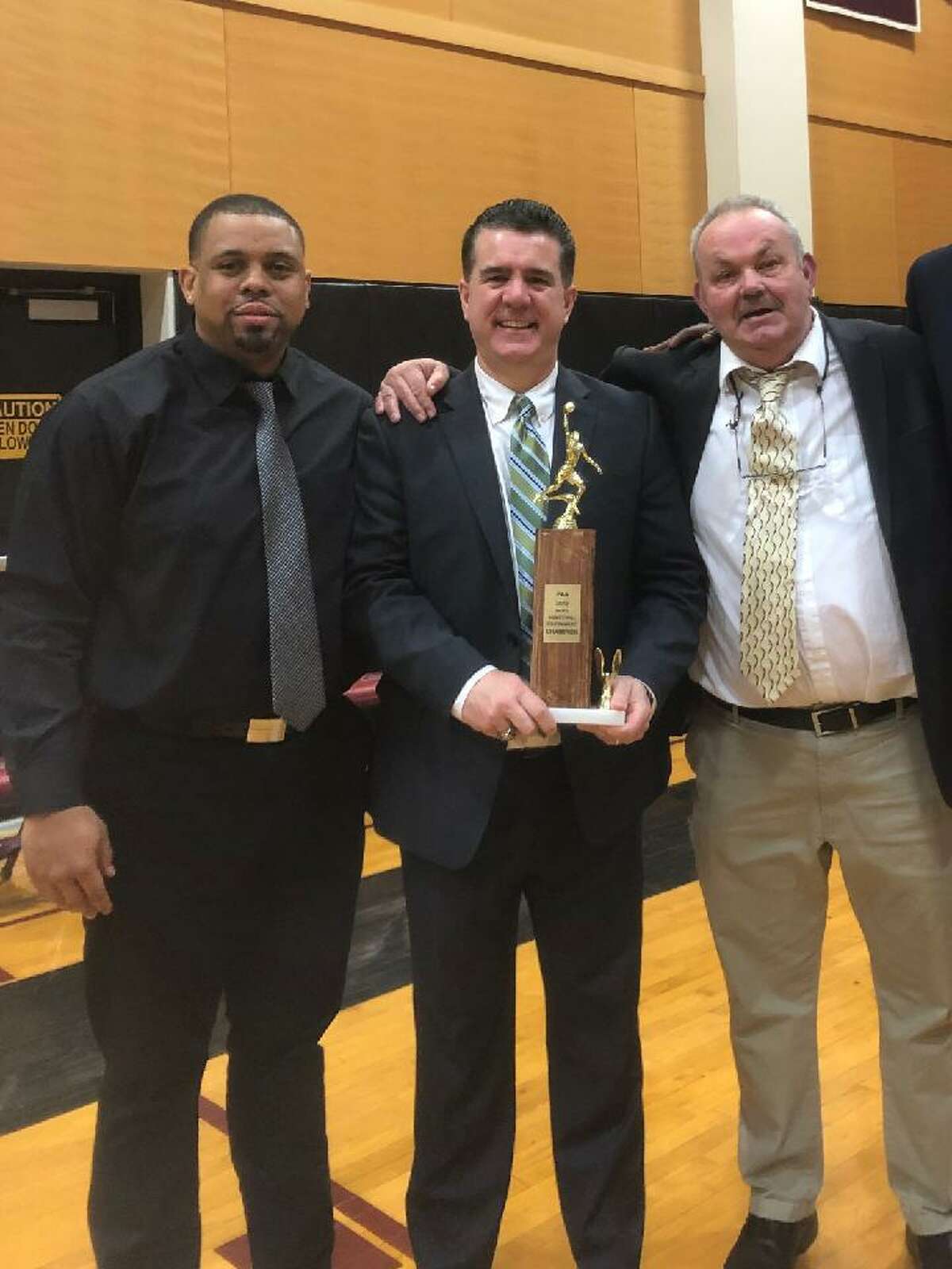 Hamden Hall boys basketball coaches, from left, Danny Oglesby, Sean Doherty and Jim Reynolds celebrate winning the 2019 NEPSAC Class B championship.