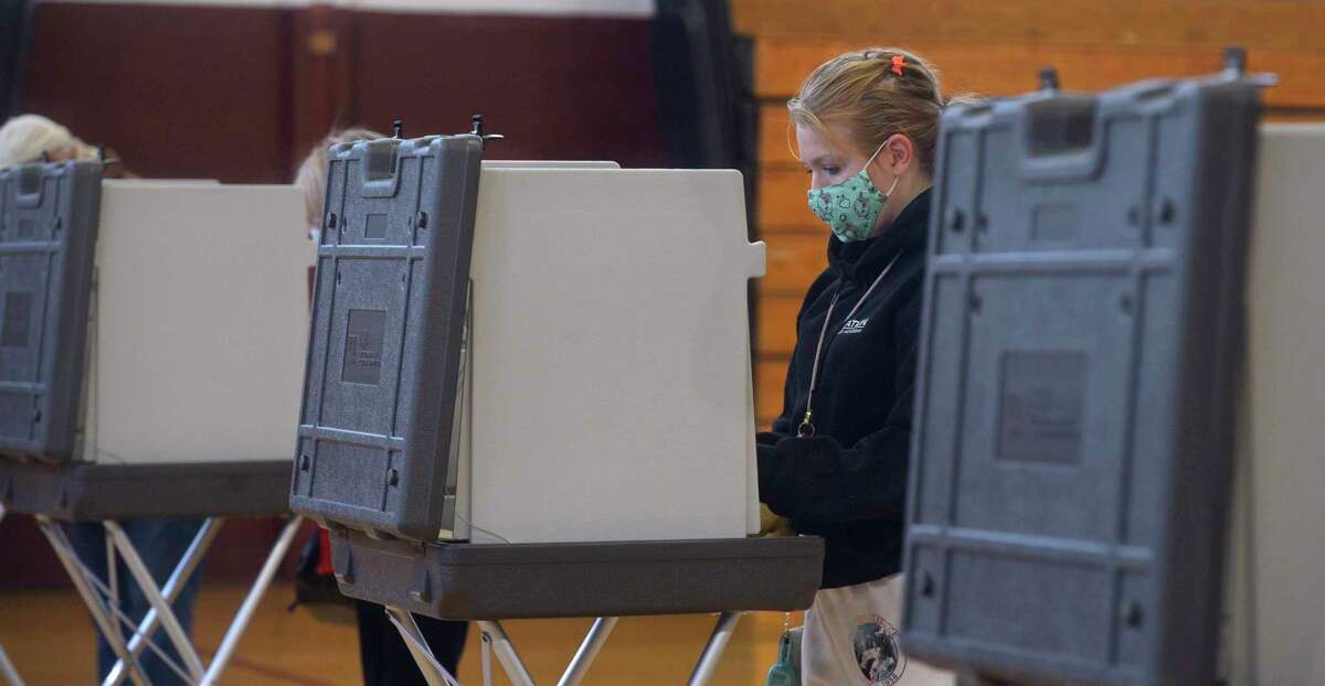 Katie Czyr, of Bethel, votes at the Municipal Center gym polling location, Election Day, Tuesday. November 3, 2020, in Bethel, Conn.