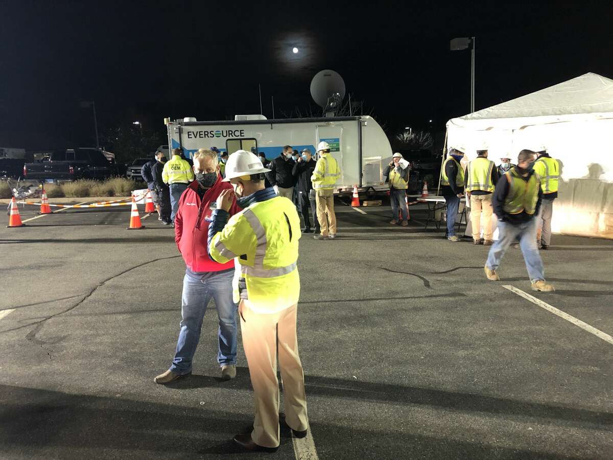 Derby Mayor Richard Dziekan speaks to Eversource crews at a staging area in the Lowe's parking lot in Derby on Tuesday evening.