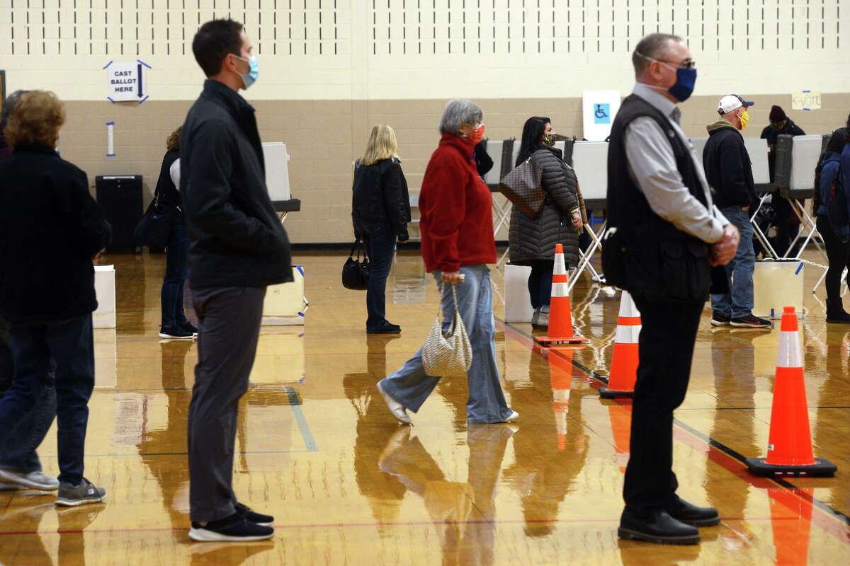 Voters wait in line on Election Day at Shelton Intermediate School.