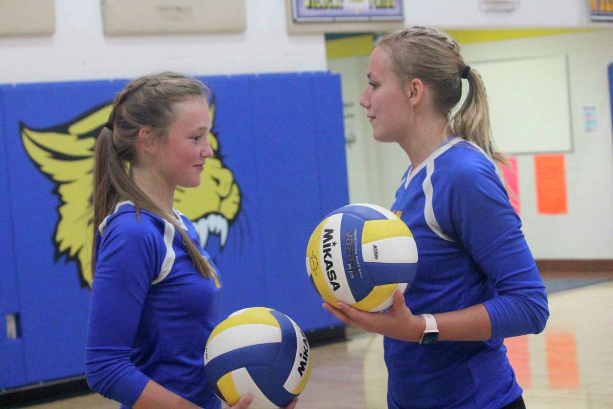 Skylar Baumgardner (left) and Kara Henry have been key players for Evart's volleyball team. (Herald Review photo/John Raffel)
