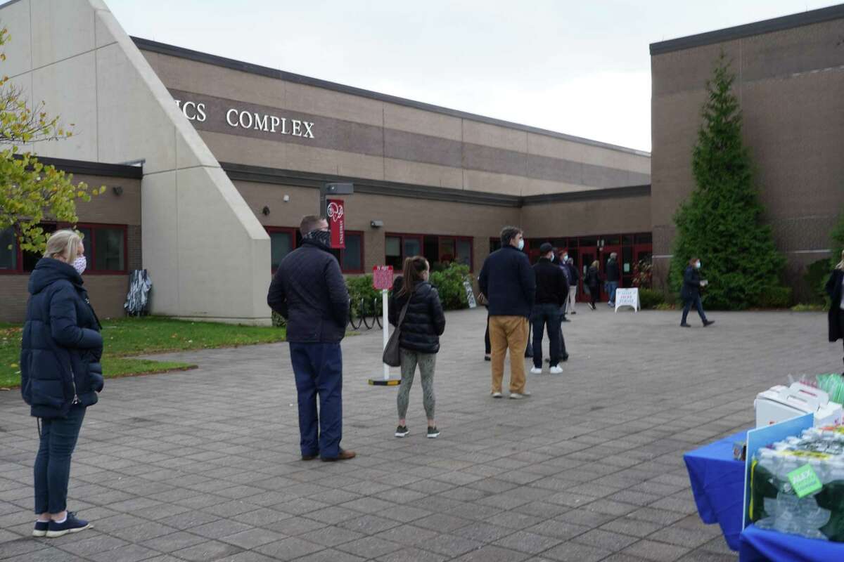 People were lining up to vote in District 1 at New Canaan High School on Tuesday, Nov. 3, 2020. Lines had been longer earlier in the morning.