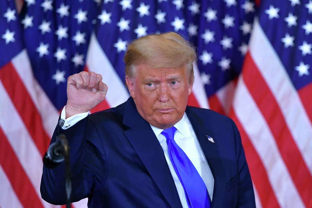 President Donald Trump pumps his fist after speaking during election night in the East Room of the White House in Washington, DC, early on November 4, 2020.