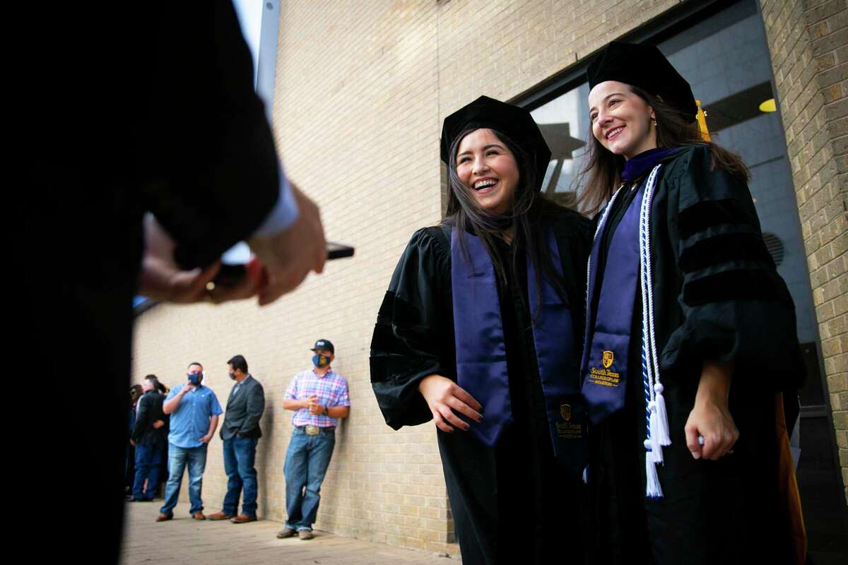 Graduates pose for a picture during a weekend of commencement ceremonies for the South Texas College of Law Houston on Saturday, Oct. 17, 2020. The school celebrated with 13 commencement ceremonies over two days to honor COVID-19 graduates.