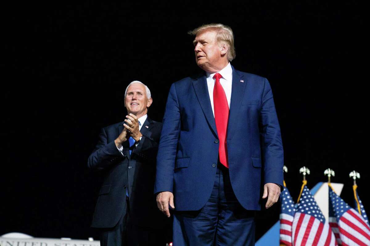 President Donald Trump and Vice President Mike Pence on stage for a rally in Newport News, Va., Sept. 25, 2020. Before President Donald Trump, the mold for appealing to evangelical Christians and social conservatives used to look a lot like Pence: strait-laced, and deeply religious with a reserved and reassuring style.