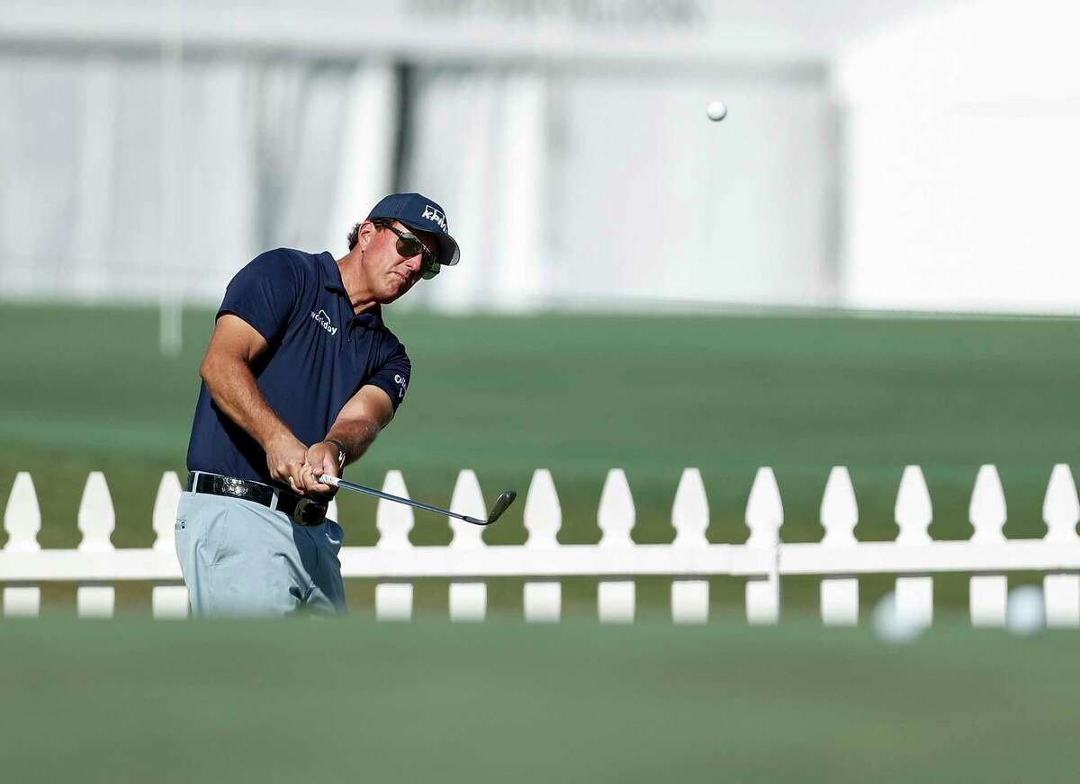 Phil Mickelson chips on the practice range during the Pro-Am at the Vivint Houston Open at Memorial Park Golf Course on Wednesday, November 4, 2020.