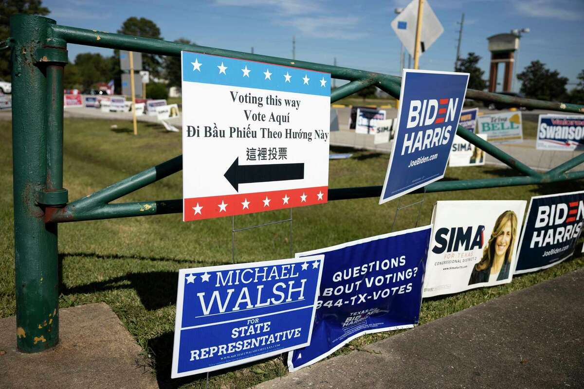 Political signs are placed near the Spring First Church on Election Day, Tuesday, Nov. 3, 2020, in Spring.