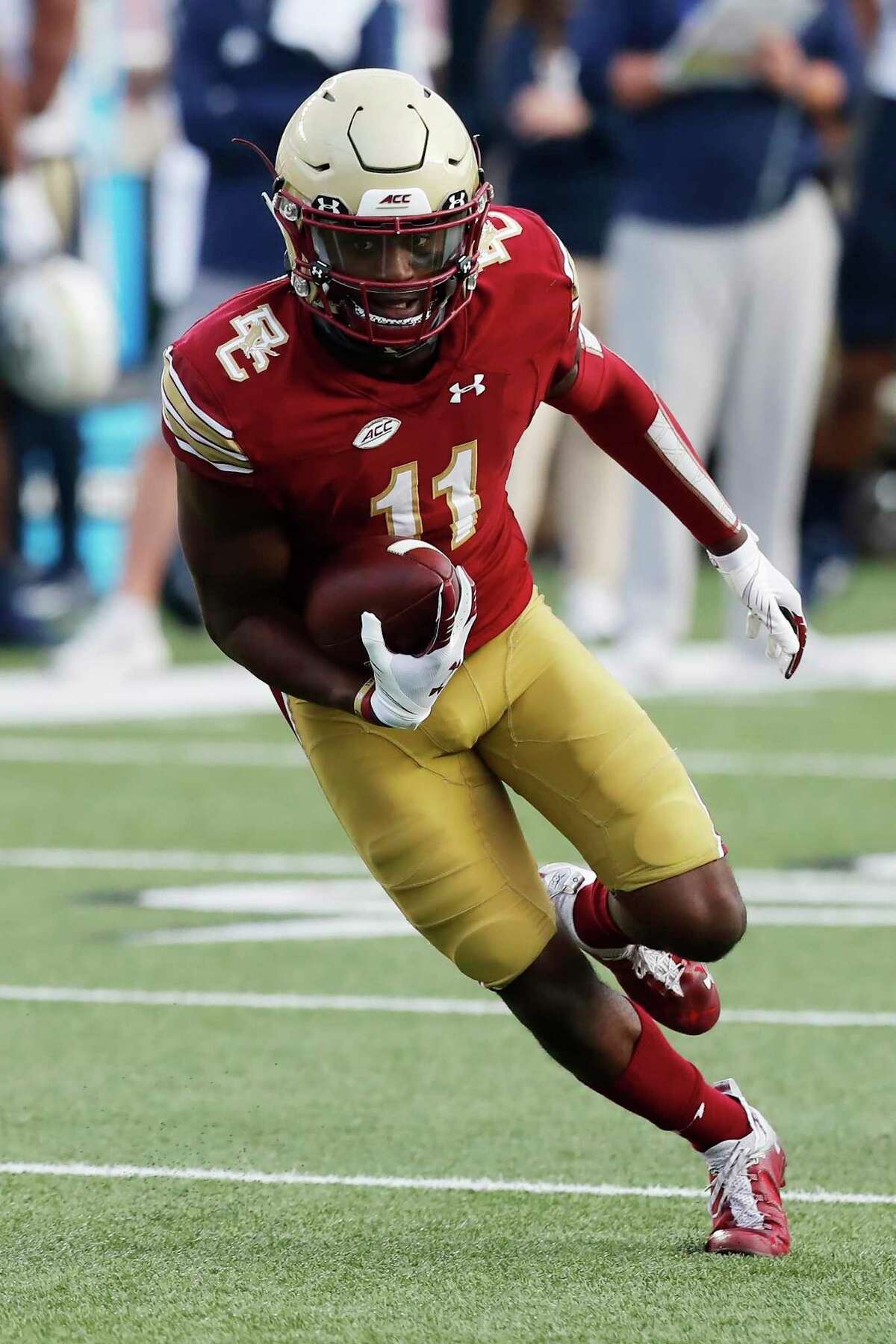 Boston College wide receiver CJ Lewis carries the ball during the first half of an NCAA college football game against Georgia Tech, Saturday, Oct. 24, 2020, in Boston. (AP Photo/Michael Dwyer)