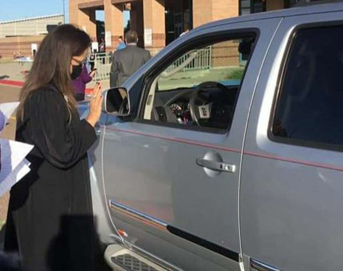 341st District Court Judge Beckie Palomo conducts drive-thru jury qualifications at the UISD Student Activity Center.