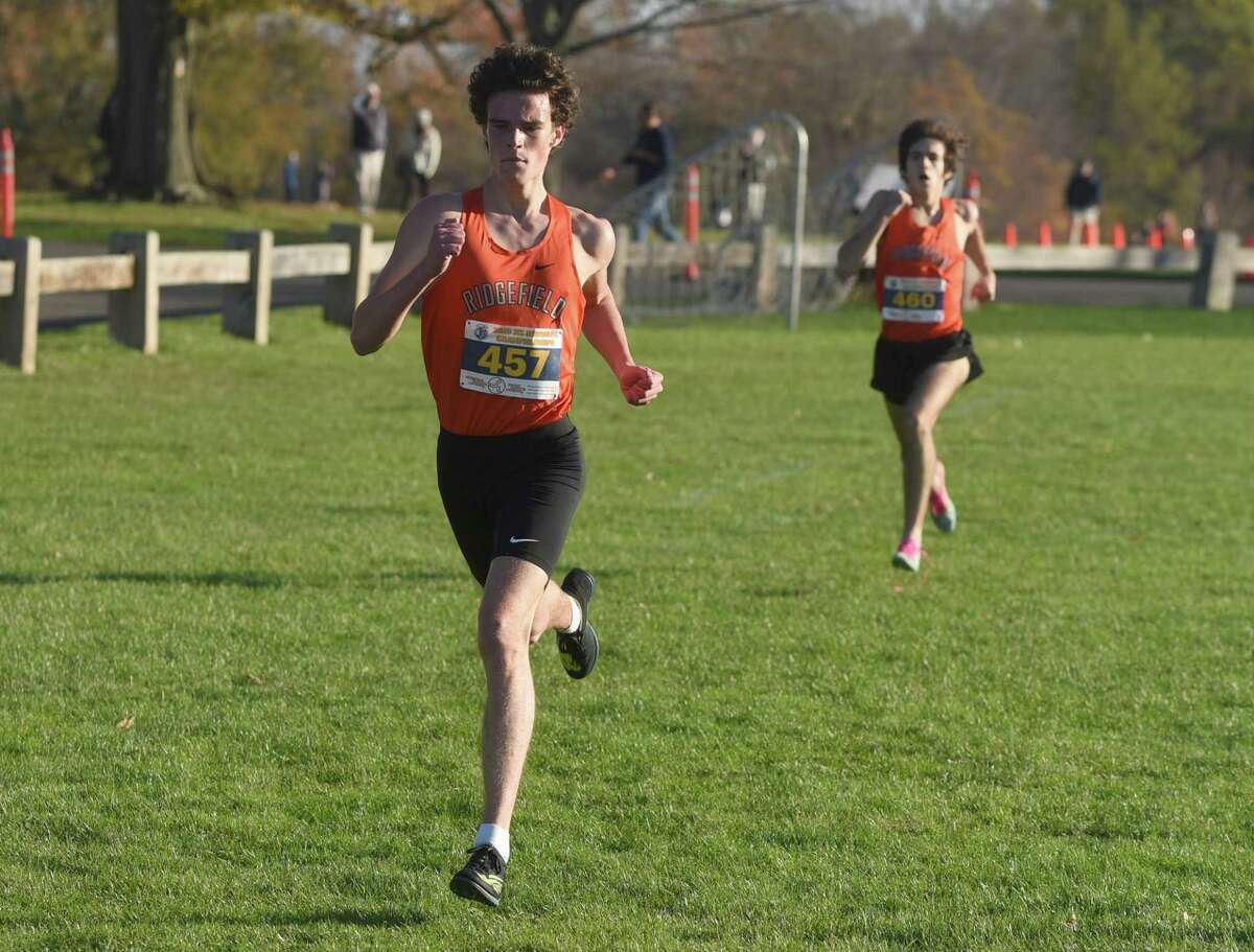 Ridgefield's Charlie King (457) and Chuckie Namiot (460) finished in the top two spots during the FCIAC East boys cross country championship race in New Canaan's Waveny Park on Wednesday, Nov. 4, 2020.