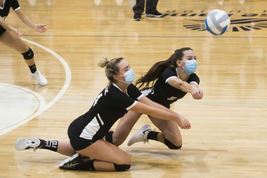 Bullock Creek's Vivian Freeland, left, and Courtney Niswander, right, dive for the ball during the Lancers' district semifinal game against Carrollton Thursday, Nov. 5, 2020 at Garber High School in Essexville. (Katy Kildee/) Photo: (Katy Kildee/)