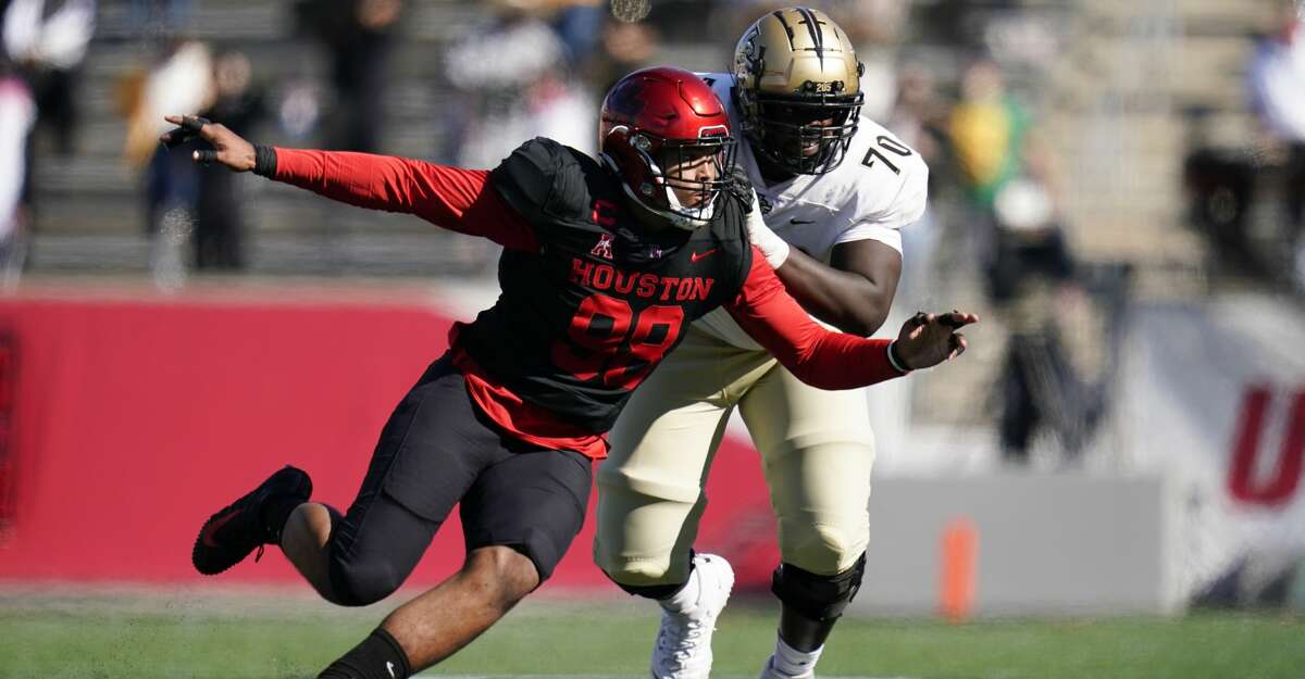 Houston defensive lineman Payton Turner (98) rushes against Edward Collins (70) during an NCAA football game against Central Florida on Saturday, Oct. 31, 2020 in Houston. (AP Photo/Matt Patterson)
