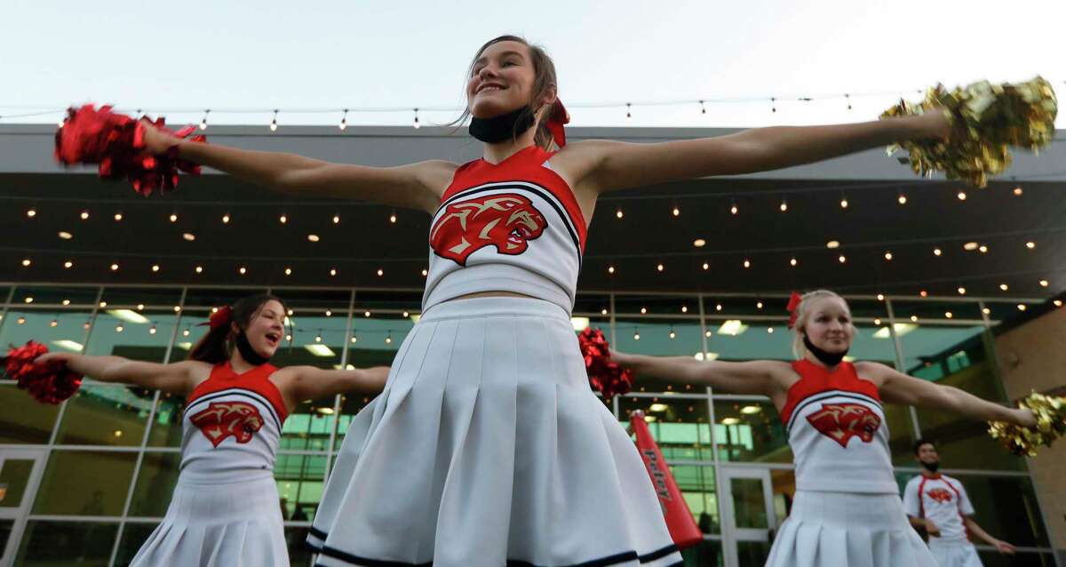 Caney Creek cheeleaders practice before a District 8-5A high school football game at Randall Reed Stadium, Thursday, Nov. 5, 2020, in New Caney.