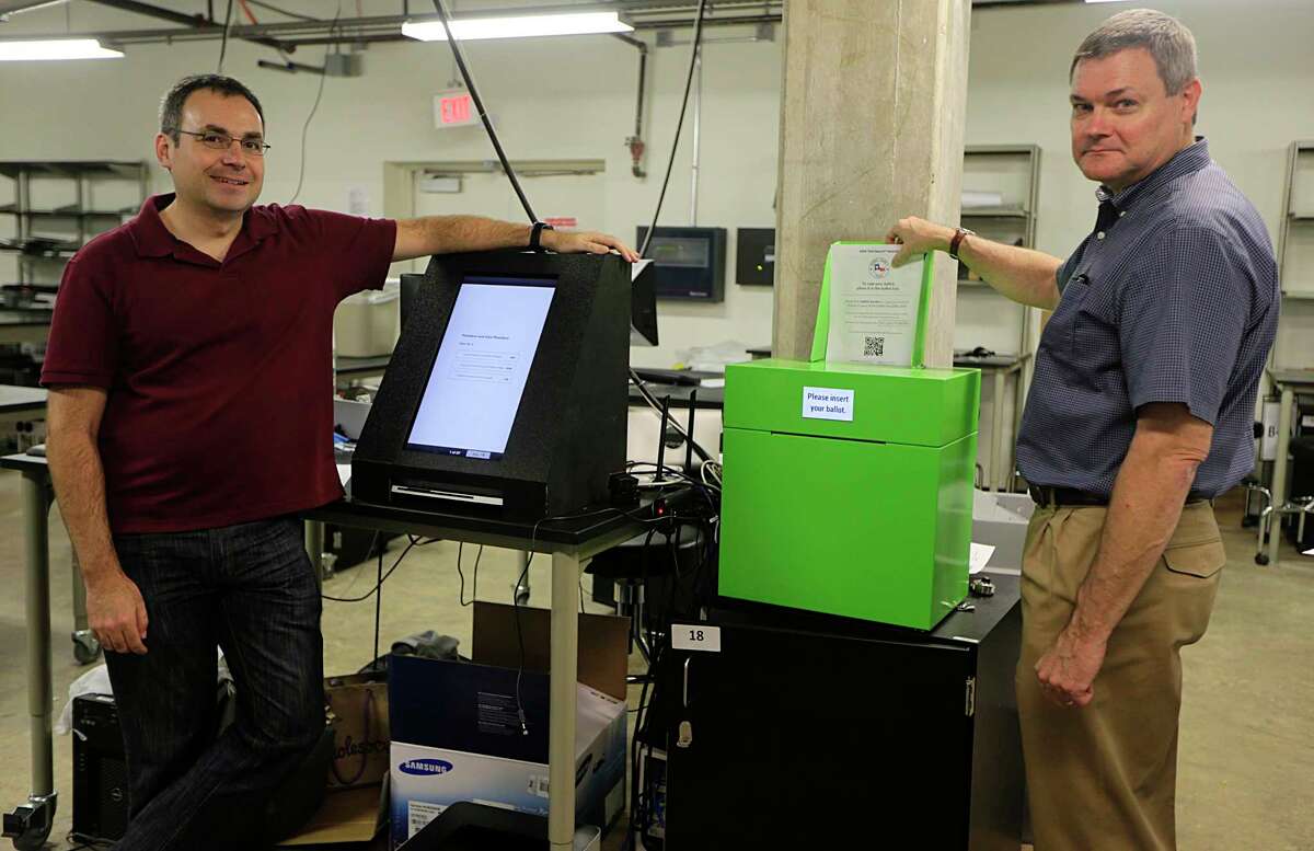 Rice University Professor Department of Computing Dan Wallach, left, and Assistant Professor Department Psychology Phil Kortum worked to develop a new voting machine for Travis County in 2016.