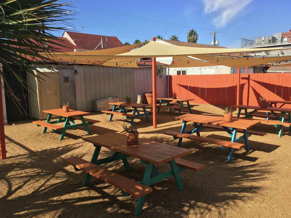 The outdoor seating space at Tony's Siesta has shade and picnic table seating.