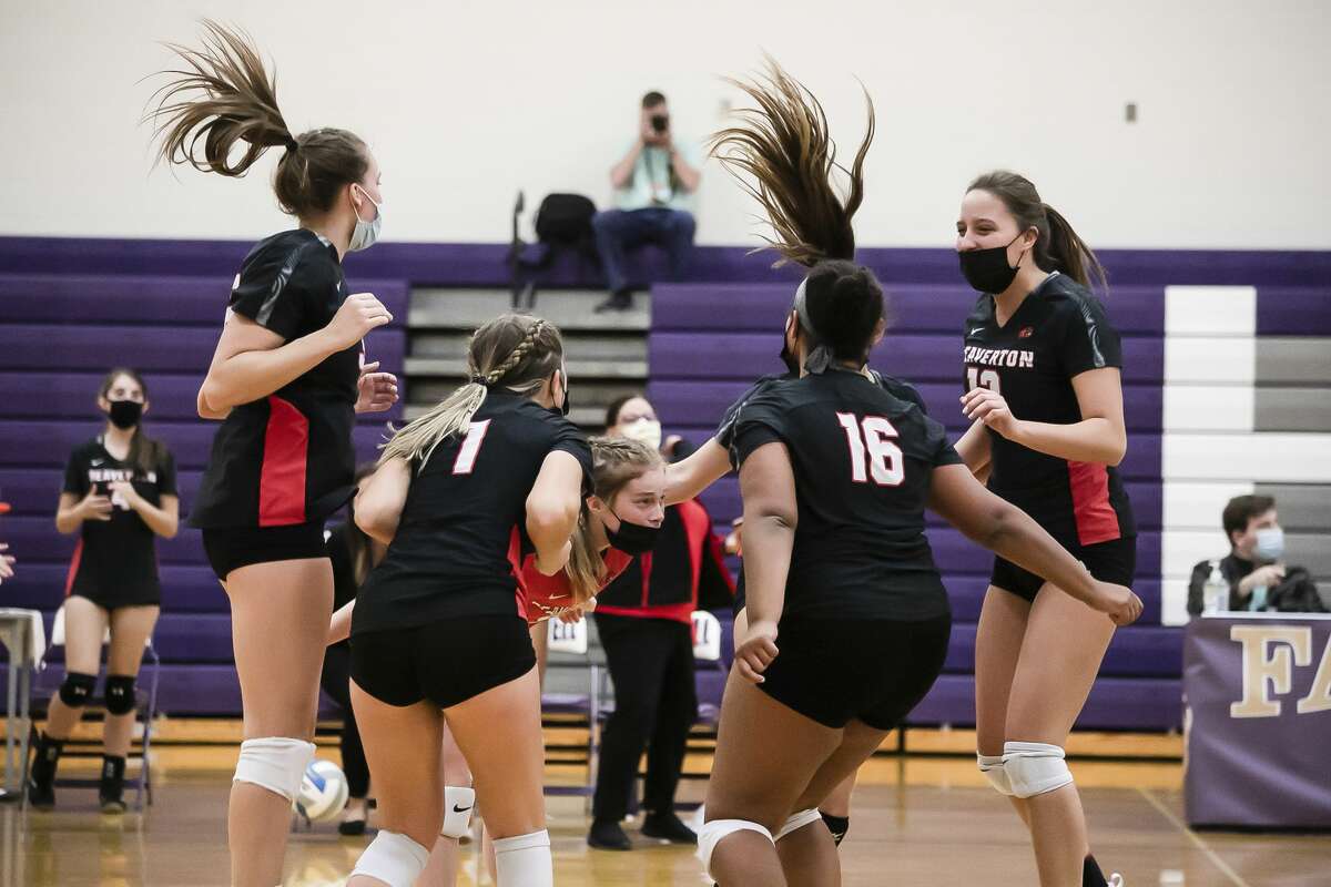 Beaverton players celebrate a point during the Beavers' district final victory over Houghton Lake Thursday, Nov. 5, 2020 at Farwell High School. (Doug Julian/for the Daily News)