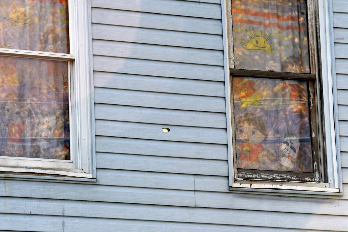 A bullet hole is visible between two bedroom windows on the former Smith family home at 114 Second Avenue on Friday, Nov. 6, 2020, in Albany, N.Y. (Will Waldron/Times Union)